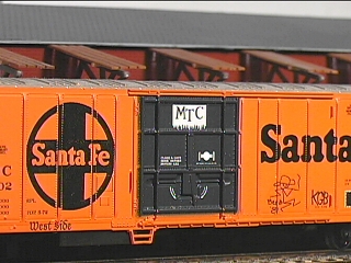 Santa Fe reefer tagged with West Side, Berdo 81, and KGB
